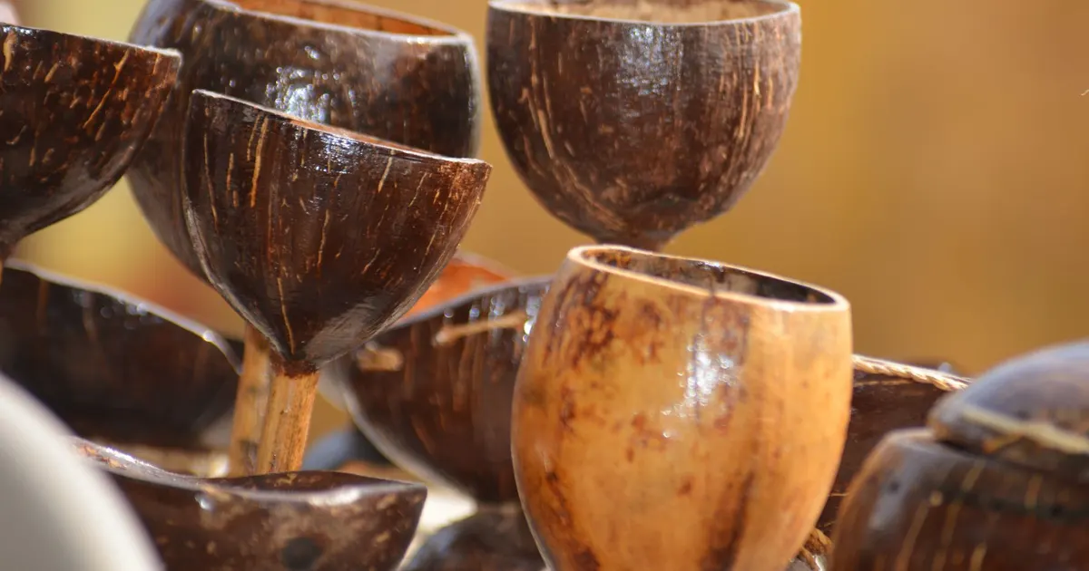 Handcrafted coconut shell cups and bowls on display, products covered in a coconut bowls wholesale guide